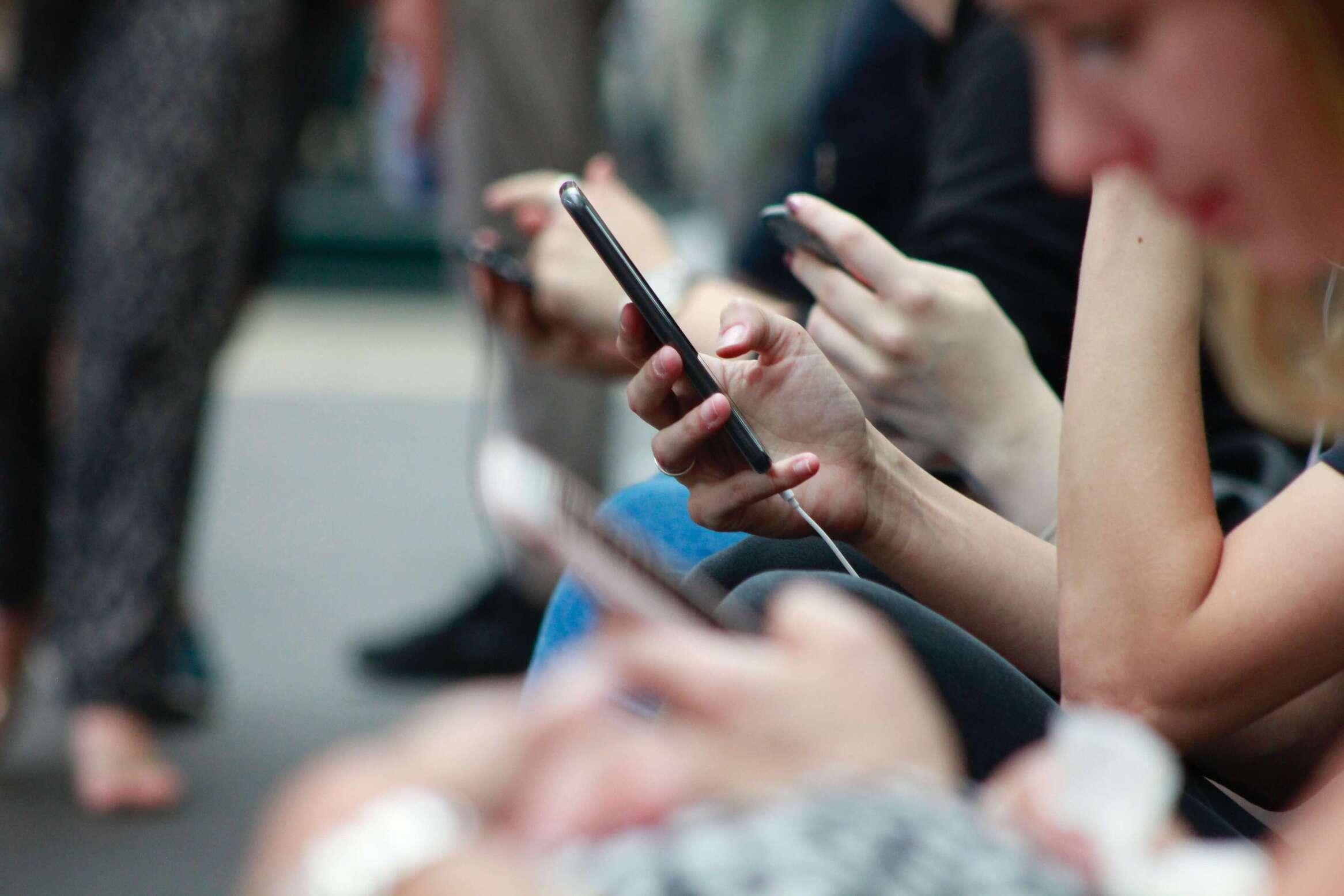 Person holding a black smartphone